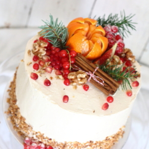 Carrot and walnut cake decorated with clementine and walnuts, made by Lovingly Baked by Anthea in Grayshott Surrey